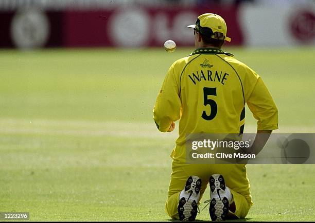 Shane Warne of Australia is brought to his knees by the Zimbabwe batsmen during the World Cup Super Six match at Lord's in London. Warne was hit for...