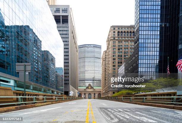 empty streets of park avenue leading to grand central station, new york city. - grand central terminal nyc stock pictures, royalty-free photos & images