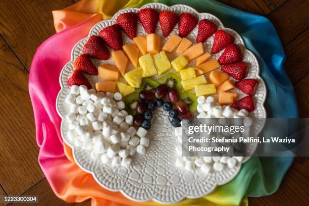 fruits and marshmallow arranged in a rainbow shape - quarantine party stock pictures, royalty-free photos & images