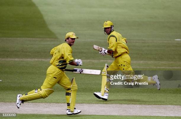 Steve and Mark Waugh of Australia running between the wickets in the World Cup Super Six match against Zimbabwe at Lord's in London. Australia won by...