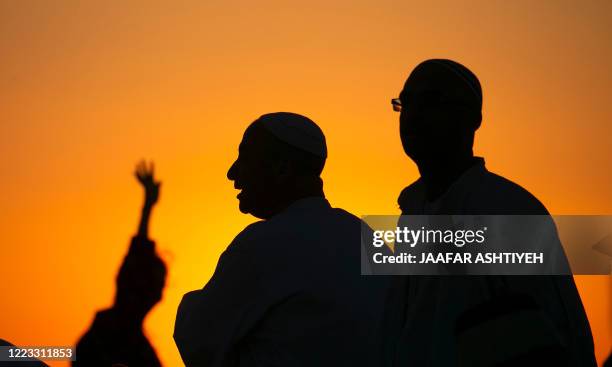 Samaritans pray on top of Mount Gerizim near the northern West Bank city of Nablus as they celebrate the Shavuot festival at dawn, on June 28, 2020....