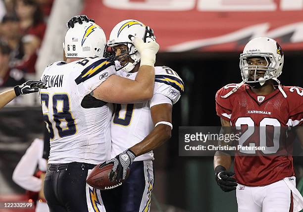 Wide receiver Malcom Floyd of the San Diego Chargers celebrates with Kris Dielman after scoring a 3 yard touchdown reception past cornerback A.J....