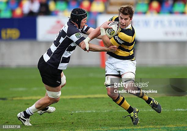 Ben Souness of Taranaki is tackled by Bryn Evans of Hawke's Bay during the round 13 ITM Cup match between Taranaki and Hawke's Bay at Yarrow Stadium...