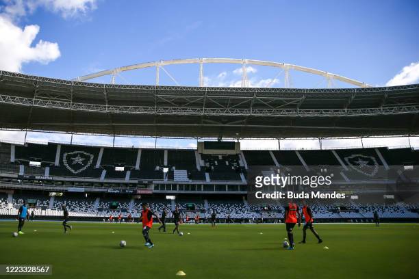 Players of Botafogo warm up prior to the match between Botafogo and Cabofriense as part of the Carioca State Championship at Nilton Santos Stadium on...
