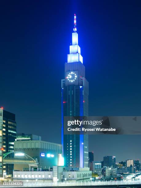 ntt docomo yoyogi building illuminated by blue - ntt docomo yoyogi building stock pictures, royalty-free photos & images