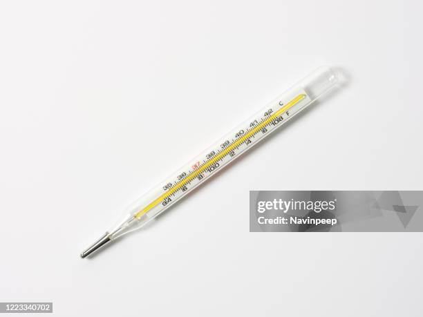 thermometer on white background - termometro fotografías e imágenes de stock