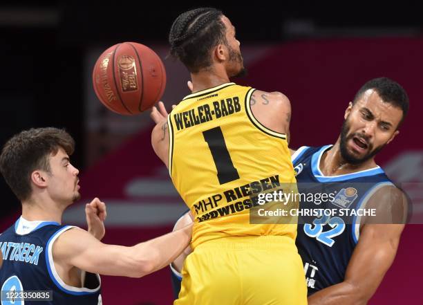 Alba Berlin's German point guard Jonas Mattisseck, MHP Riesen Ludwigsburg's US shooting guard Nick Weiler-Babb and Alba Berlin's German center...