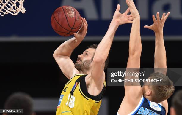 Riesen Ludwigsburg's German center Jonas Wohlfarth-Bottermann and Alba Berlin's German power forward Lorenz Brenneke vie during the German basketball...