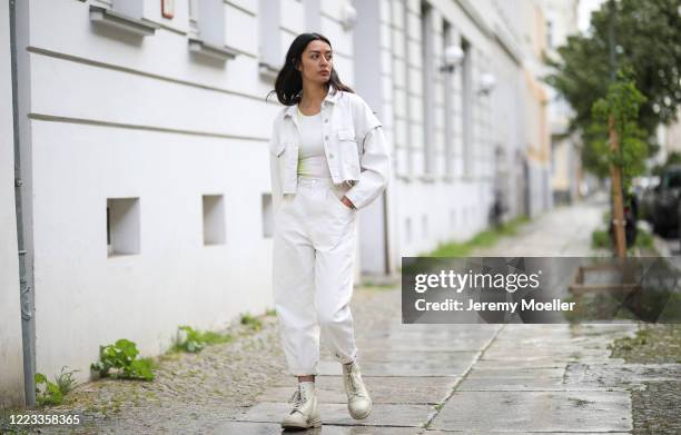 Alyssa Cordes wearing Zara jeans combi, Dr Martens shoes and Urban Outfitters shirt on May 05, 2020 in Berlin, Germany.