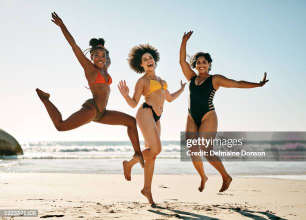 living a carefree life - women in bathing suits stock pictures, royalty-free photos & images