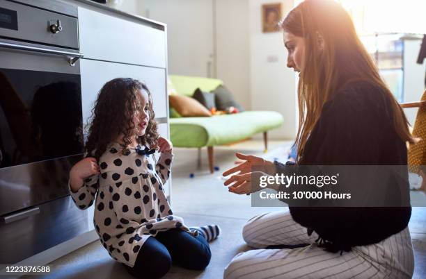 mother and daughter playing in kitchen - respect kids stock pictures, royalty-free photos & images