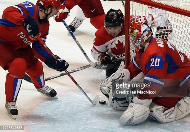 Evgeni Nabokov of Russia is seen in action as Canada claim a 7-3 victory over Russia during Men's Playoffs Quarterfinals - Game 24 at Canada Hockey...