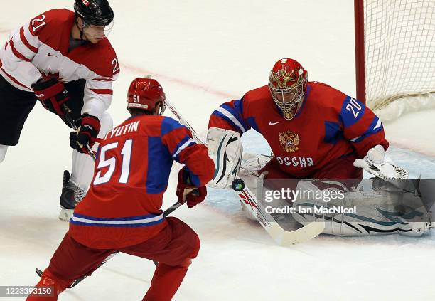 Evgeni Nabokov of Russia is seen in action as Canada claim a 7-3 victory over Russia during Men's Playoffs Quarterfinals - Game 24 at Canada Hockey...