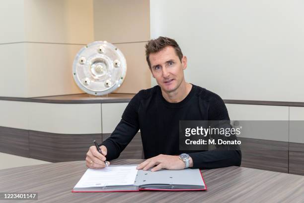 Miroslav Klose poses as he signs his new contract as assistant coach of FC Bayern Muenchen on May 07, 2020 in Munich, Germany. Klose will be head...