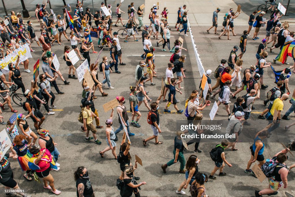 Minority Rights Rally Demonstrators march in the streets during a Pride rally on June 28 ...