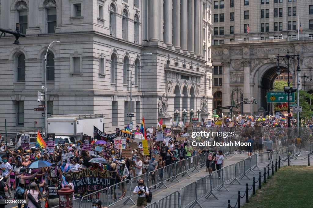 Gay Rights Rally People wearing masks participate during the the Queer March for Black ...