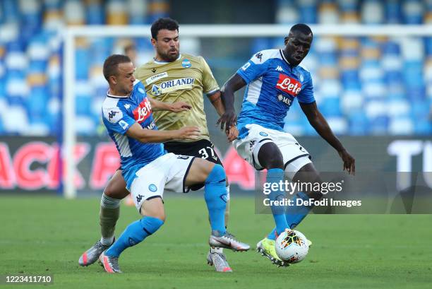 Stanislav Lobotka of Napoli, Andrea Petagna of SPAL and Kalidou Koulibaly of Napoli battle for the ball during the Serie A match between SSC Napoli...