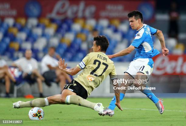 Felipe of SPAL and Hirving Lozano of Napoli battle for the ball during the Serie A match between SSC Napoli and SPAL at Stadio San Paolo on June 28,...