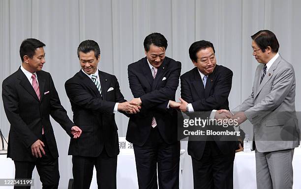 Candidates for the leadership of the Democratic Party of Japan shake hands before a debate in Tokyo, Japan, on Sunday, Aug. 28, 2011. From left to...
