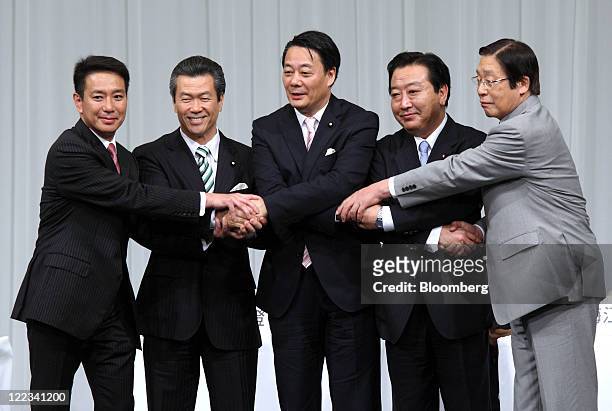 Candidates for the leadership of the Democratic Party of Japan shake hands before a debate in Tokyo, Japan, on Sunday, Aug. 28, 2011. From left to...