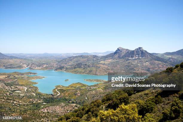 the landscape surrounding zahara de la sierra in andalusia, spain - grazalema photos et images de collection