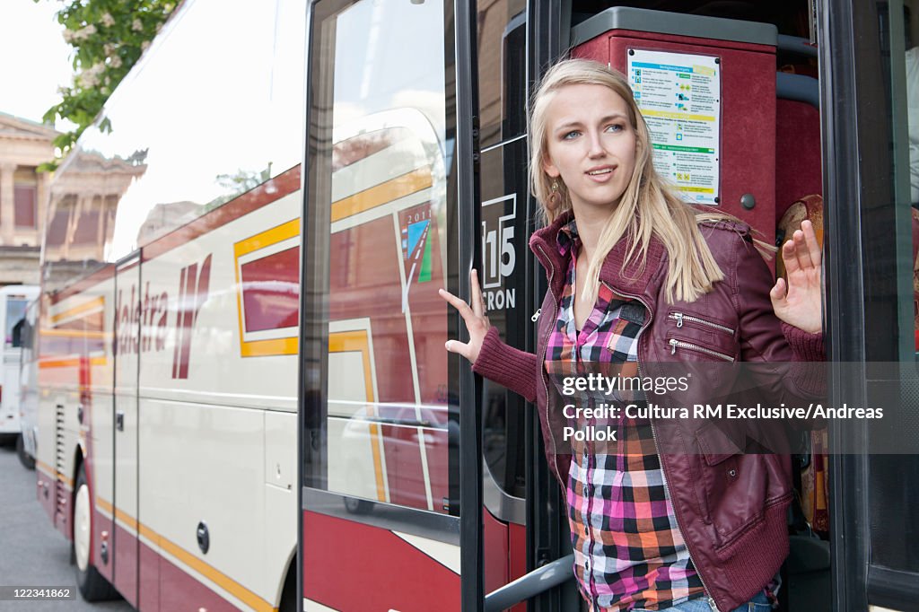 Woman riding urban bus