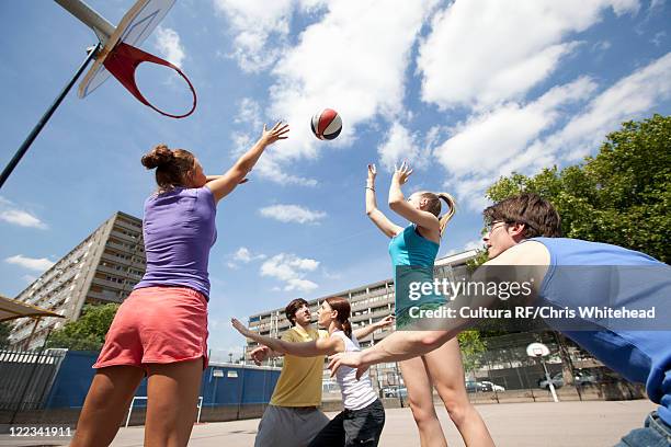 friends playing basketball together - shooting baskets stock pictures, royalty-free photos & images