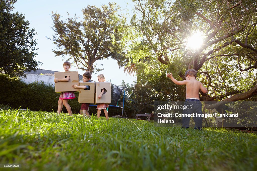 Children With Box Children Playing With Cardboard Boxes High-Res Stock Photo - Getty Images