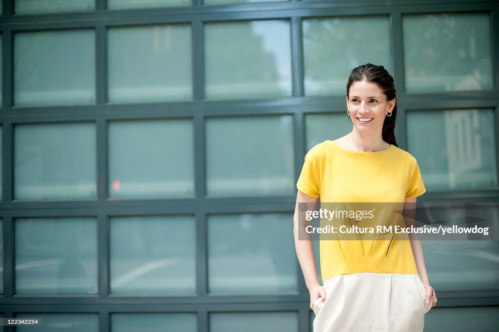 Woman standing on city street