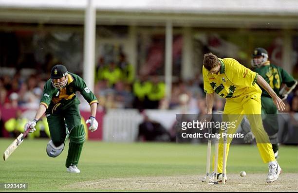 Glenn McGrath of Australia runs out Steve Elworthy of South Africa in the World Cup semi-final at Edgbaston in Birmingham, England. The match...