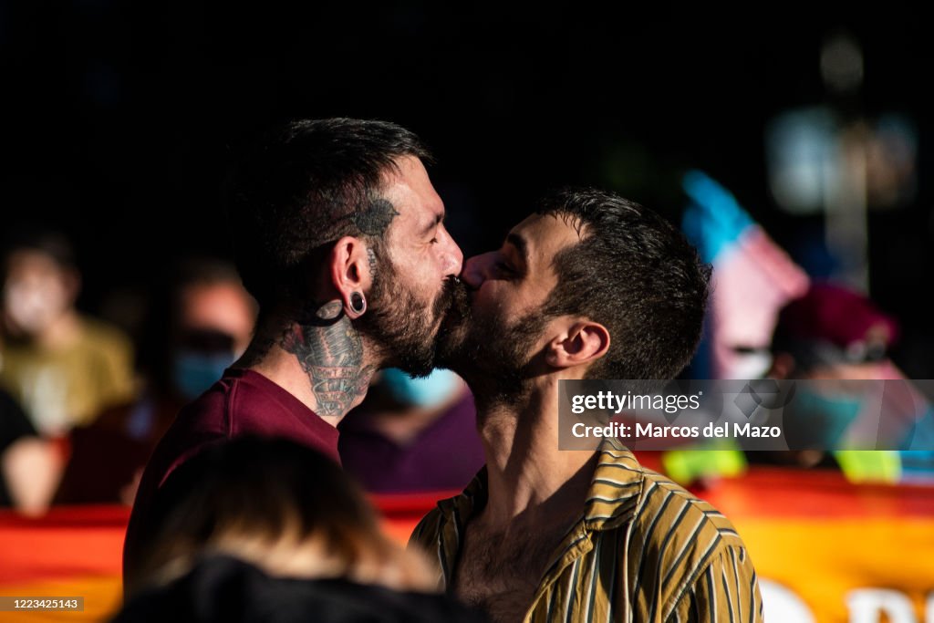 Demonstrators kiss each other during the 2020 Critical Pride...