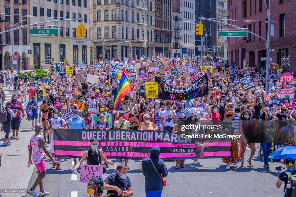 Thousands March In A crowd of thousands marching behind the main banner. Reclaim Pride ...