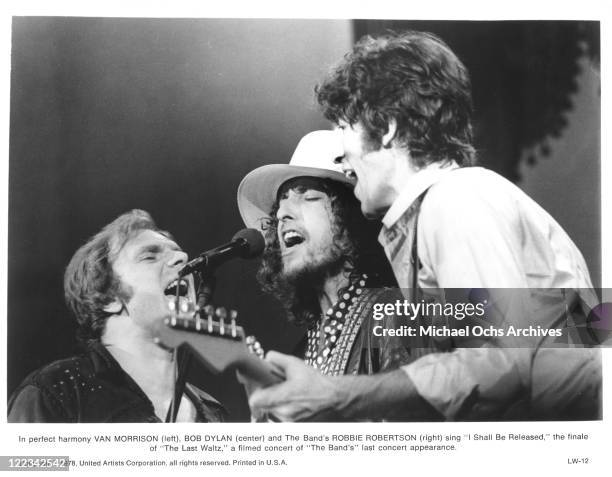 Robbie Robertson of The Band with Van Morrison and Bob Dylan perform at The Band's farewll concert released on film as 'The Last Waltz' at Winterland...