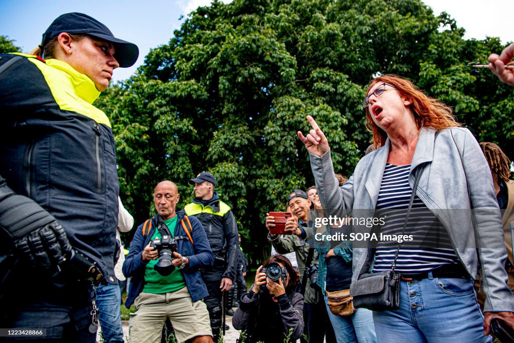 Protestet A protester arguing with police during the demonstration. Riot police ...