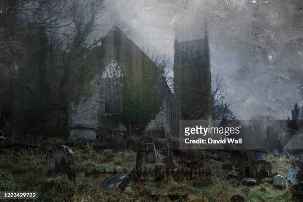 a spooky, abandoned graveyard with a ruined church in the background. with a vintage, grunge edit. - spooky graveyard stock pictures, royalty-free photos & images