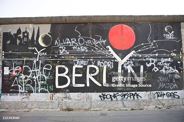 graffiti on berlin wall, berlin, germany - berlin graffiti stock-fotos und bilder