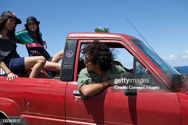 three young friends driving off road vehicle on vacation - 3 guy friends road trip stock pictures, royalty-free photos & images