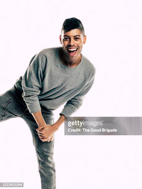 Portrait of happy man standing on white background