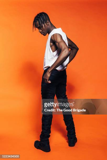 young man standing in studio - tank top stock pictures, royalty-free photos & images