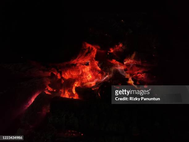 close-up of fire embers against black background - burning embers stock pictures, royalty-free photos & images