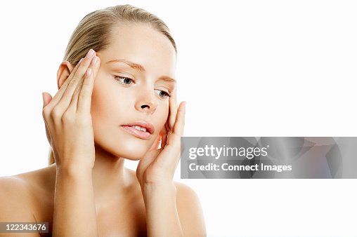 Young Woman Contemplating Face Lift High-Res Stock Photo - Getty Images