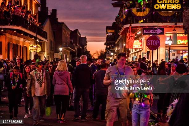 Partying on Bourbon Street during the evening of Mardi Gras on 25th February 2020 in New Orleans, Louisiana, United States. Mardi Gras is the biggest...