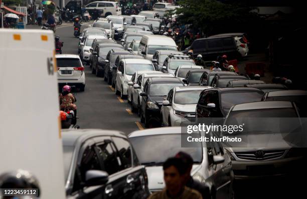 Vehicle seen with traffic jam at a street in Puncak, Bogor, West Java, Indonesia, June 28, 2020. After the Indonesian government lifted restrictions...