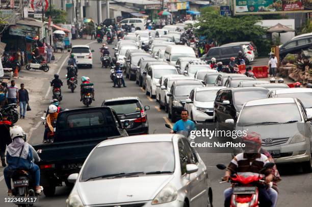Vehicle seen with traffic jam at a street in Puncak, Bogor, West Java, Indonesia, June 28, 2020. After the Indonesian government lifted restrictions...