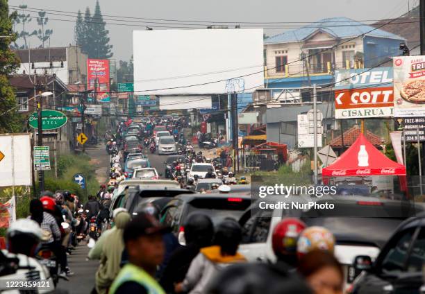 Vehicle seen with traffic jam at a street in Puncak, Bogor, West Java, Indonesia, June 28, 2020. After the Indonesian government lifted restrictions...