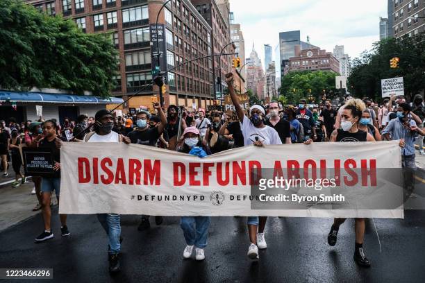 Protesters march down the Bowery voicing their opposition to the current state of policing on June 29, 2020 in New York City. The march followed a...