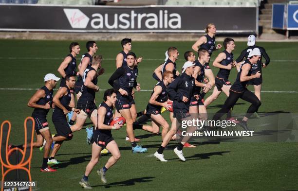 Carlton Aussie Rules player Eddie Betts trains with teammates in Melbourne on June 30, 2020. - Australian Rules teams came together to take a knee in...