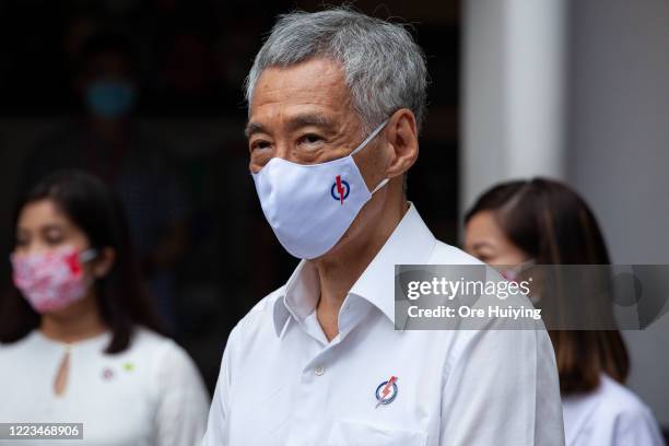 Singapore's Prime Minister Lee Hsien Loong, the secretary general of the ruling People's Action Party, speaks to the media at a nomination center...