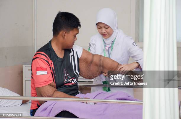 Nurse checks the Aria arm before surgery in the intensive care unit room, Hasan Sadikin Hospital, Bandung, West Java, Indonesia. ONCE known as the...