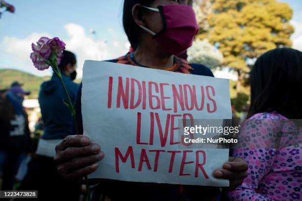 Indigenous women from the Embera communities in Colombia along with feminists gather in front of the military compound 'Canton Norte' to protest...